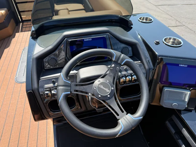 Slide: The Image of Steering console of 2026 Bentley Pontoons Elite 253 QSB with Simrad displays. - 23