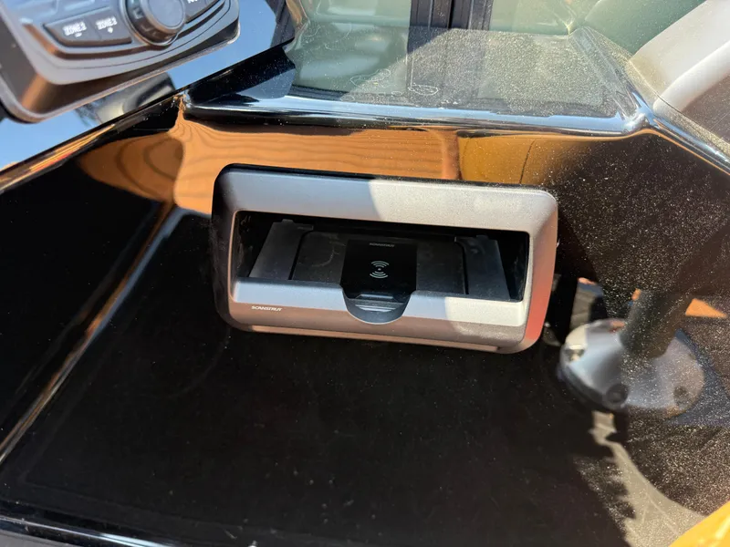 Slide: The Image of 2026 Bentley Pontoons Elite 253 QSB dashboard with wireless charging dock. - 25