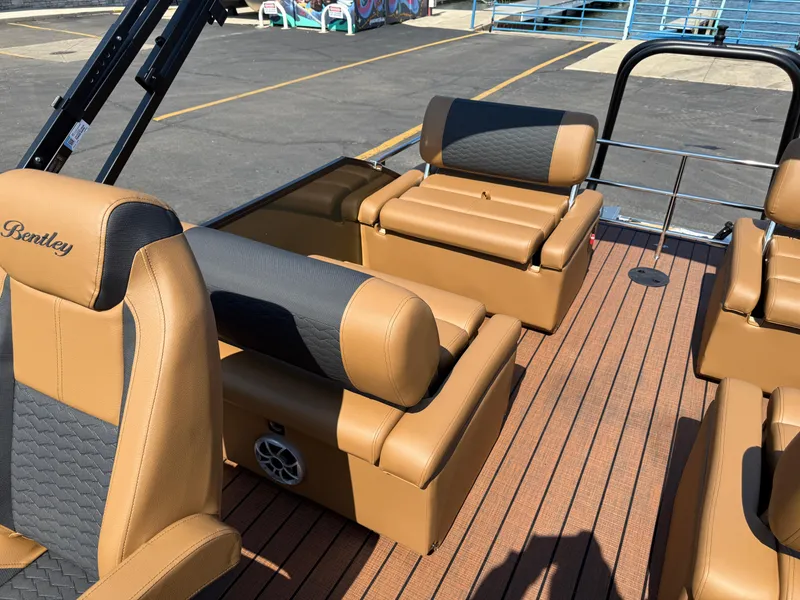 Slide: The Image of 2026 Bentley Pontoons Elite 253 QSB interior with tan and black seating. - 28