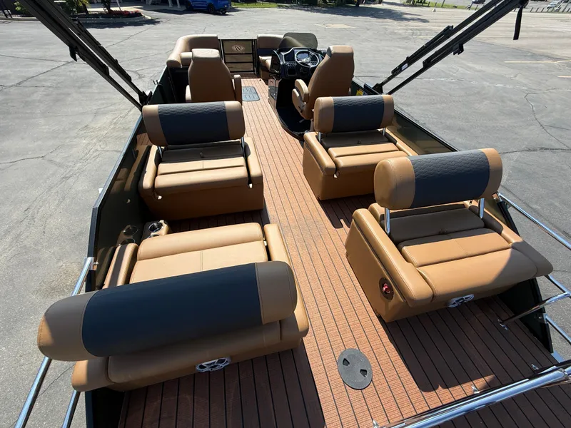Slide: The Image of 2026 Bentley Pontoons Elite 253 QSB with luxurious tan seating and sleek design. - 33
