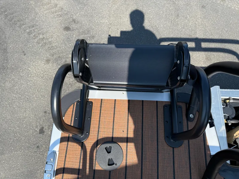 Slide: The Image of 2026 Bentley Pontoons Elite 253 QSB deck with black railing and wood finish. - 35