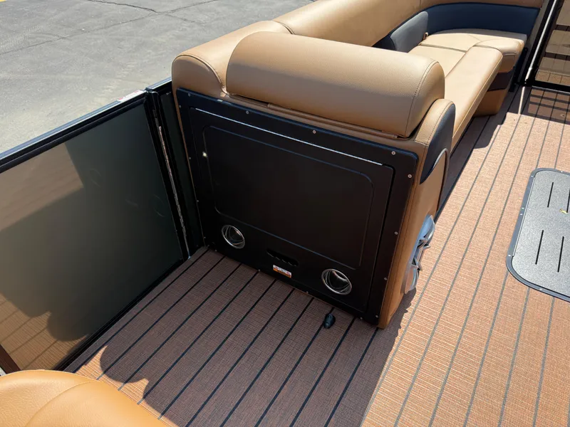 Slide: The Image of 2026 Bentley Pontoons Elite 253 QSB interior with tan seating and sleek flooring. - 36