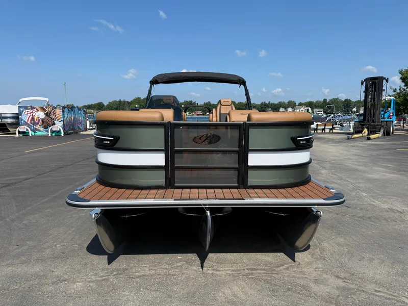 Slide: The Image of 2026 Bentley Pontoons Elite 253 QSB on display at a marina. - 7