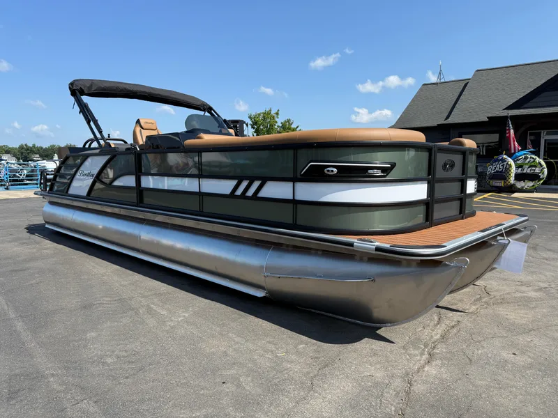Slide: The Image of 2026 Bentley Pontoons Elite 253 QSB pontoon boat with sleek design, docked outdoors. - 8