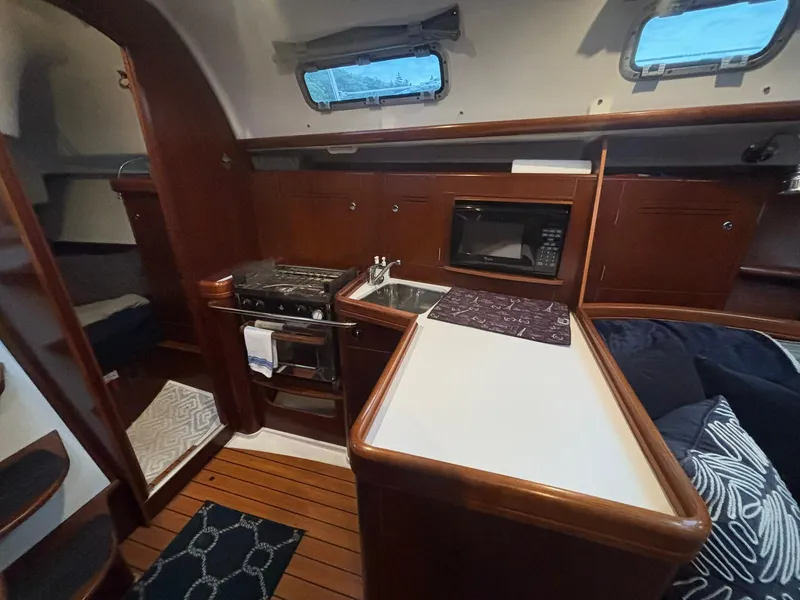 Slide: The Image of Interior of 2006 Beneteau 343 Sloop with kitchen, stove, and microwave. - 11