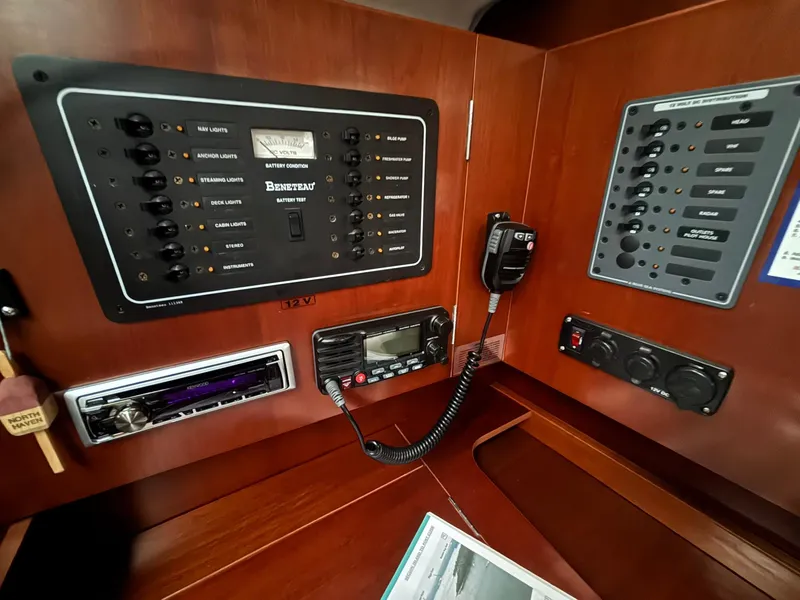 Slide: The Image of Control panel of a 2006 Beneteau 343 Sloop, featuring navigation and communication equipment. - 21