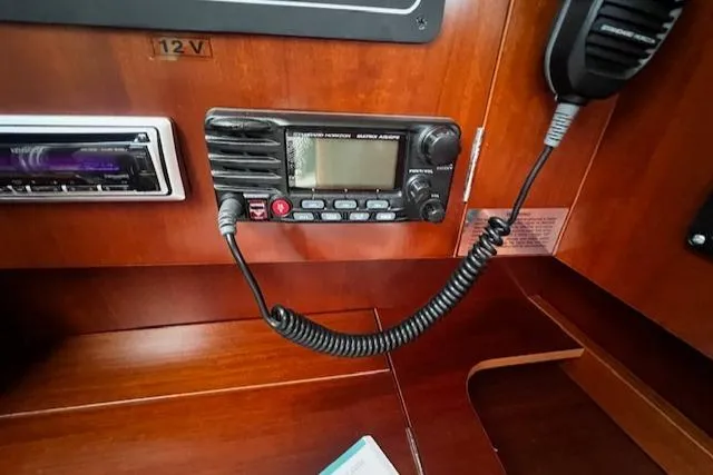 Slide: The Image of VHF radio and control panel on 2006 Beneteau 343 Sloop yacht. - 23