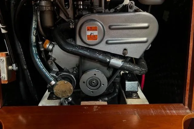 Slide: The Image of Engine compartment of a 2006 Beneteau 343 Sloop sailboat, showcasing mechanical components. - 29