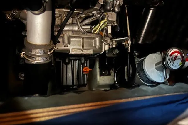 Slide: The Image of Engine compartment of a 2006 Beneteau 343 Sloop, showcasing mechanical components. - 31