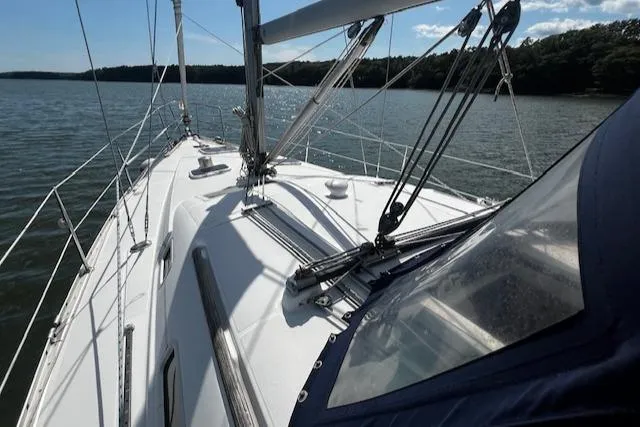 Slide: The Image of 2006 Beneteau 343 Sloop sailing on calm waters under a clear sky. - 35