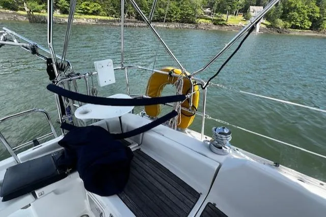 Slide: The Image of 2006 Beneteau 343 Sloop sailboat cockpit with scenic water and shoreline view. - 39