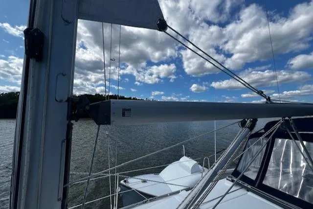Slide: The Image of 2006 Beneteau 343 Sloop sailing on a lake under a partly cloudy sky. - 41