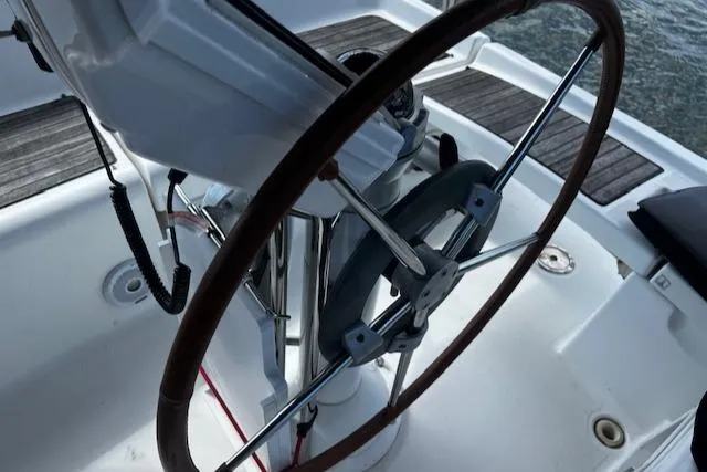 Slide: The Image of Steering wheel of a 2006 Beneteau 343 Sloop sailboat, showcasing cockpit details. - 42