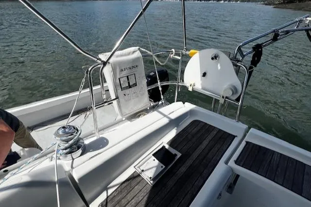 Slide: The Image of 2006 Beneteau 343 Sloop cockpit with winch, seating, and water view. - 45