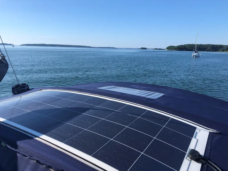 Slide: The Image of Solar panels on a 2006 Beneteau 343 Sloop sailboat, anchored on a calm sea. - 49