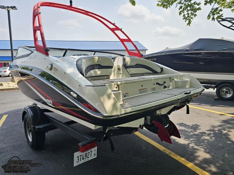 Slide: The Image of 2019 Yamaha Boats AR195 on trailer, featuring sleek design and vibrant red accents. - 28