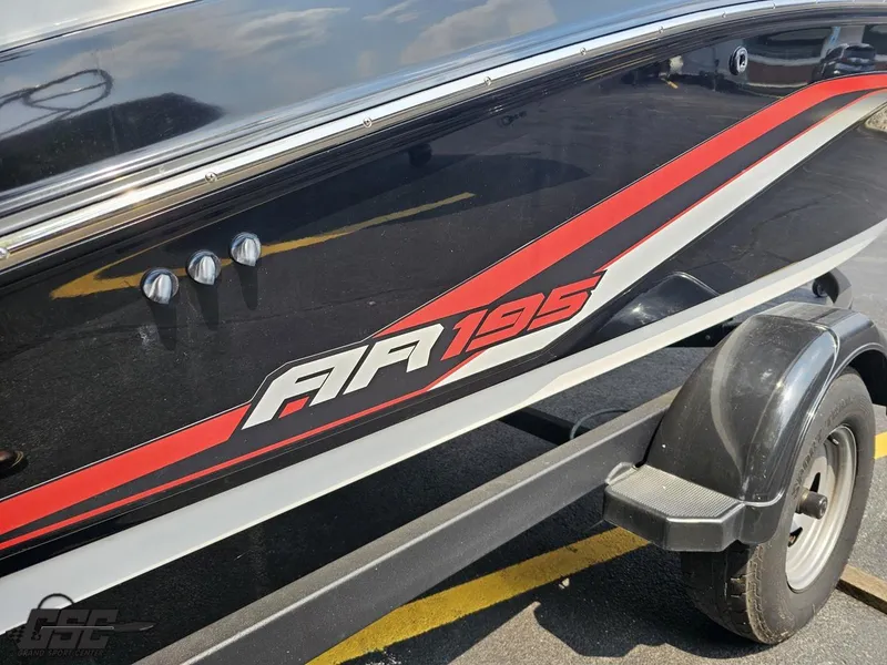 Slide: The Image of 2019 Yamaha Boats AR195 with sleek black and red design on a trailer. - 34