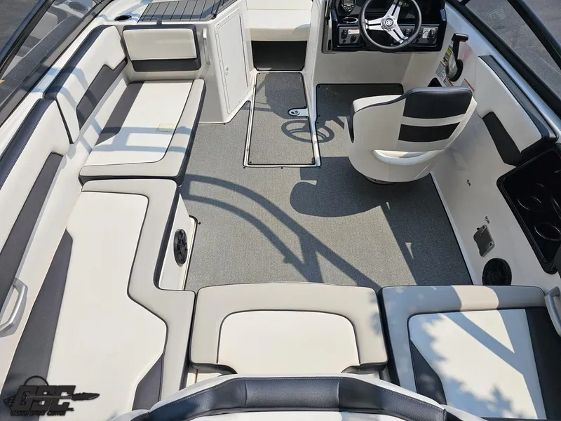 Slide: The Image of 2019 Yamaha Boats AR195 interior with seating, steering wheel, and carpeted floor. - 40