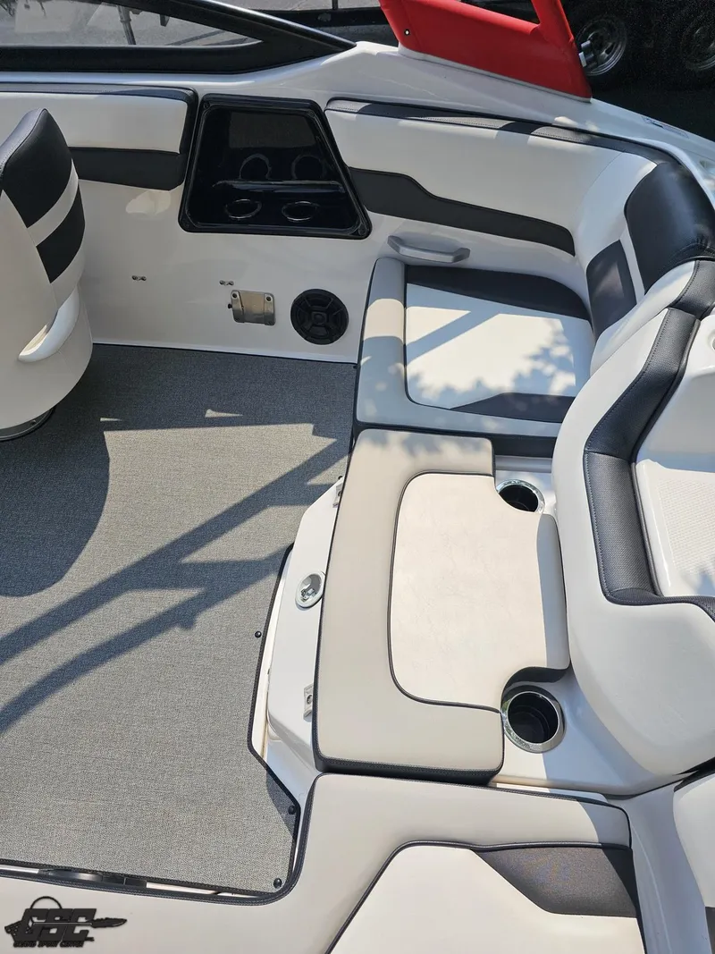 Slide: The Image of 2019 Yamaha Boats AR195 interior with cushioned seating and cup holders. - 43