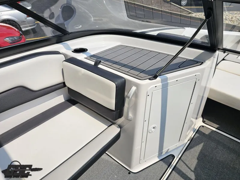 Slide: The Image of 2019 Yamaha Boats AR195 interior seating and storage area, featuring sleek design and comfortable upholstery. - 49