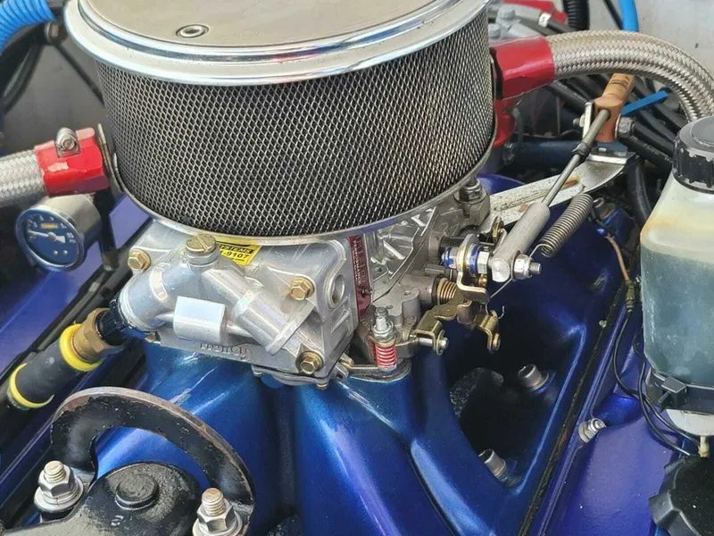 Slide: The Image of 1996 Wellcraft SCARAB engine close-up with air filter and components. - 21