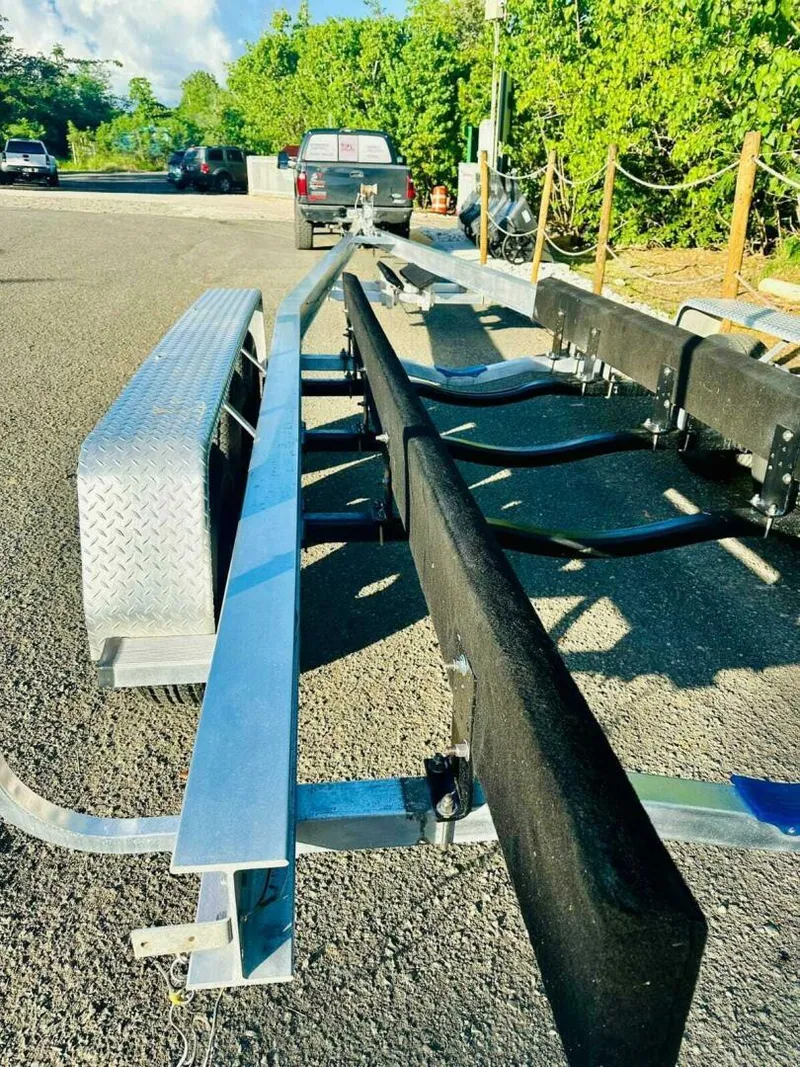 Slide: The Image of Boat trailer for 1996 Wellcraft SCARAB on sunny day, parked on asphalt. - 23