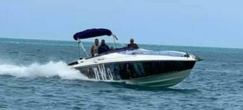 Slide: The Image of 1996 Wellcraft SCARAB speedboat cruising on open water. - 8