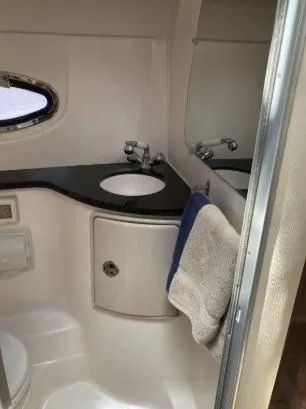 Slide: The Image of 2013 Regal 30 Express bathroom with sink, mirror, and towel. - 24
