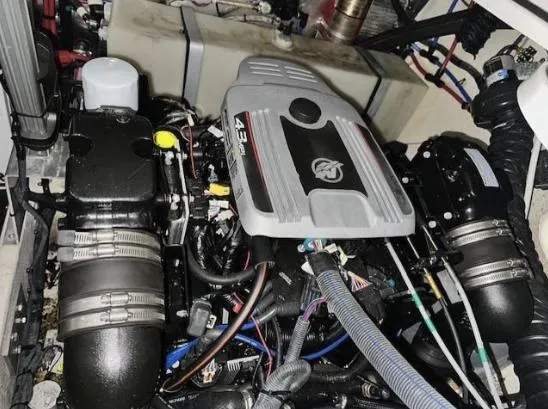 Slide: The Image of Engine compartment of a 2013 Regal 30 Express boat, showcasing mechanical components and wiring. - 27