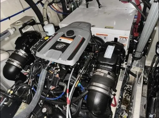 Slide: The Image of Engine compartment of a 2013 Regal 30 Express boat, showcasing mechanical components. - 28