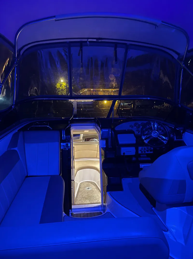 Slide: The Image of Interior of 2013 Regal 30 Express boat with blue ambient lighting. - 31