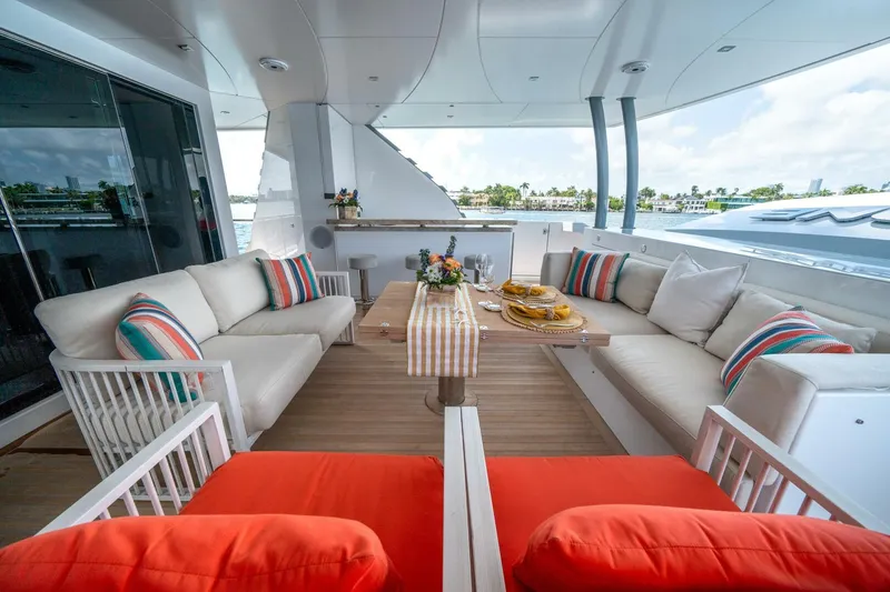 Slide: The Image of Luxurious 2020 Hargrave C92 yacht deck with elegant seating and vibrant cushions. - 13
