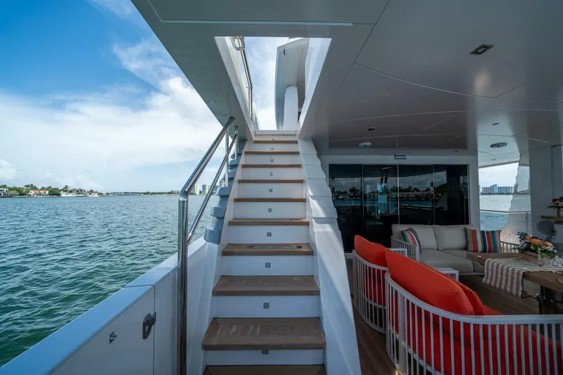 Slide: The Image of Luxurious 2020 Hargrave C92 yacht interior with staircase and elegant seating area. - 14