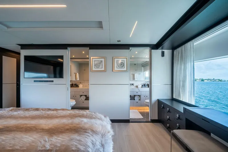Slide: The Image of Luxurious Hargrave C92 yacht bedroom with ocean view, modern decor, and ensuite bathroom, 2020 model. - 27