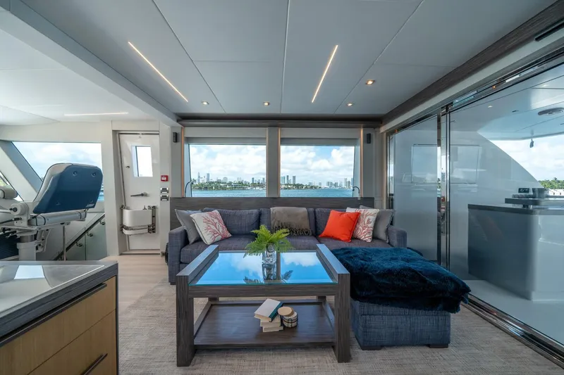 Slide: The Image of Luxurious interior of 2020 Hargrave C92 yacht with modern furnishings and panoramic windows. - 36