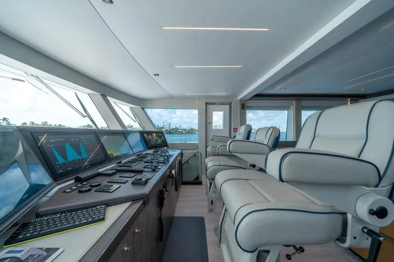 Slide: The Image of Luxurious 2020 Hargrave C92 yacht helm with modern controls and plush seating. - 38