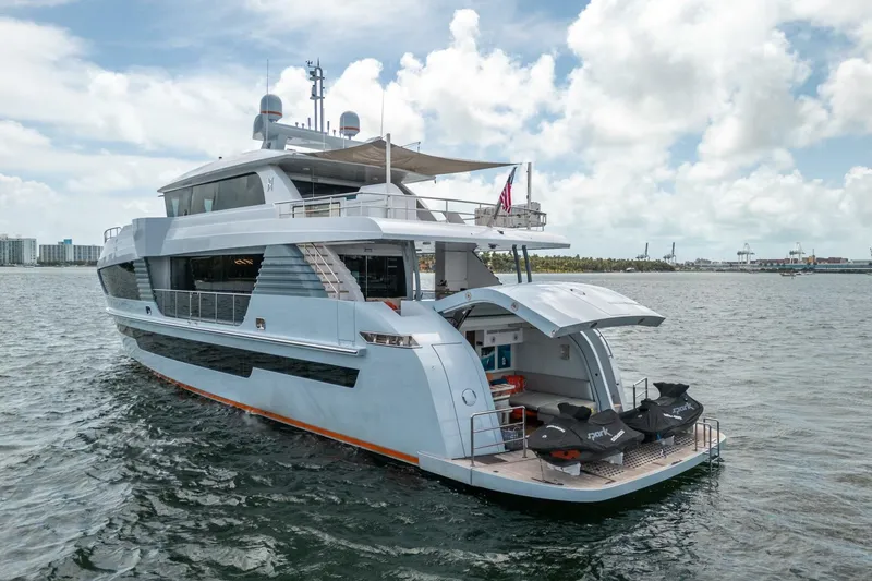 Slide: The Image of Luxury 2020 Hargrave C92 yacht on water, featuring sleek design and spacious deck. - 4