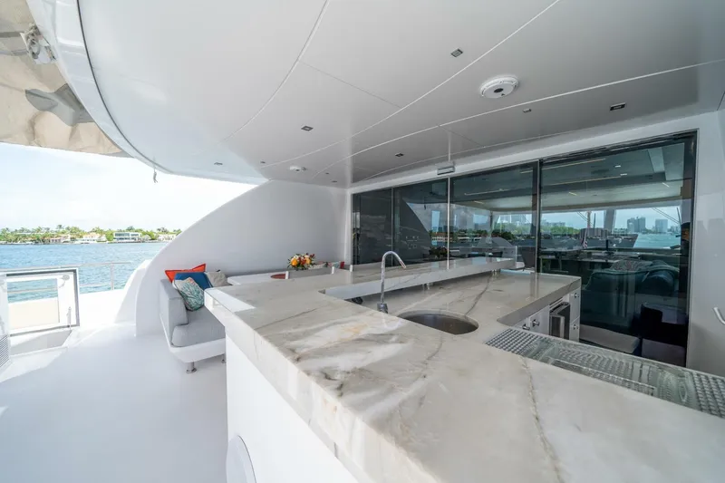 Slide: The Image of Luxurious 2020 Hargrave C92 yacht deck with marble bar and waterfront view. - 40