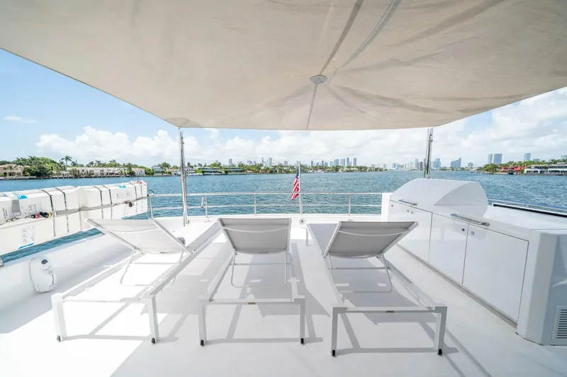 Slide: The Image of Luxurious 2020 Hargrave C92 yacht deck with sun loungers and ocean view. - 44