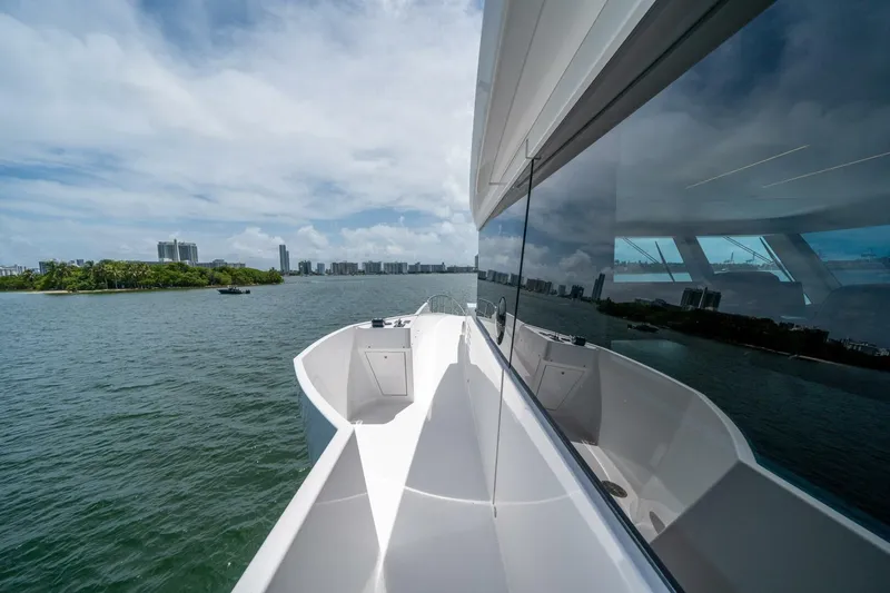Slide: The Image of 2020 Hargrave C92 yacht cruising on a scenic waterway with city skyline. - 46