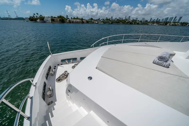 Slide: The Image of Luxury Hargrave C92 yacht deck with ocean view, 2020 model, featuring sunbathing area and rolled towel. - 48