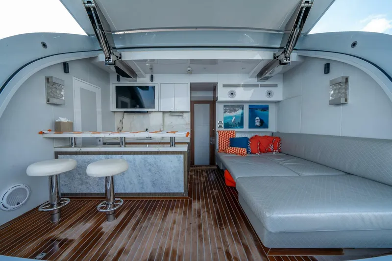 Slide: The Image of Luxurious interior of 2020 Hargrave C92 yacht with modern seating and bar area. - 8