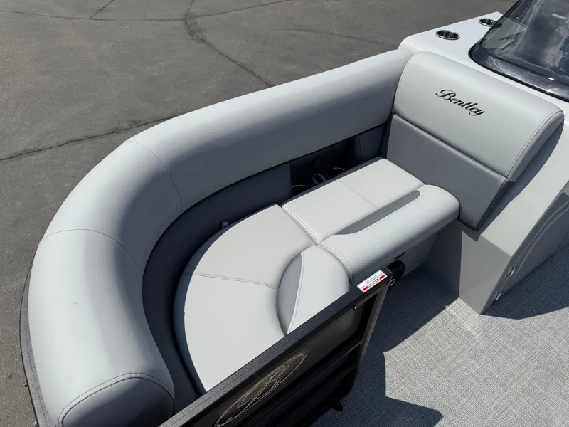Slide: The Image of 2026 Bentley Pontoons Legacy 200 Navigator interior seating with elegant gray upholstery. - 10