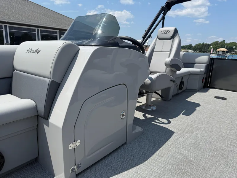 Slide: The Image of 2026 Bentley Pontoons Legacy 200 Navigator interior with sleek seating and modern design. - 14