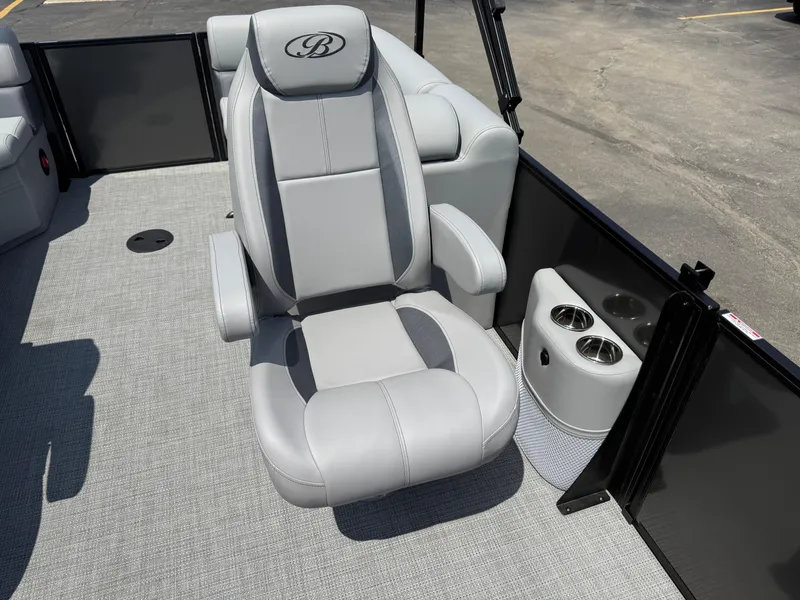 Slide: The Image of 2026 Bentley Pontoons Legacy 200 Navigator seat with cup holders on a pontoon boat. - 15