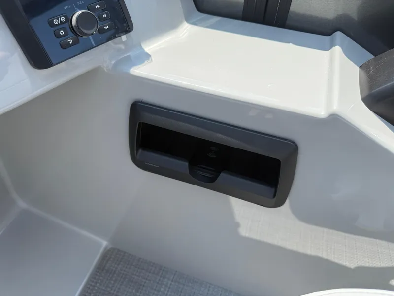 Slide: The Image of 2026 Bentley Pontoons Legacy 200 Navigator dashboard with control panel and storage compartment. - 20