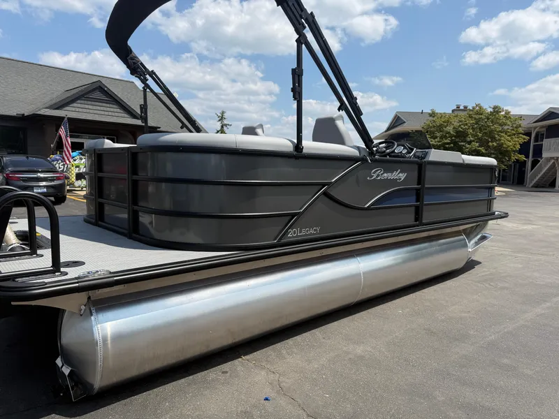 Slide: The Image of 2026 Bentley Pontoons Legacy 200 Navigator on display, sleek design, parked outdoors. - 3