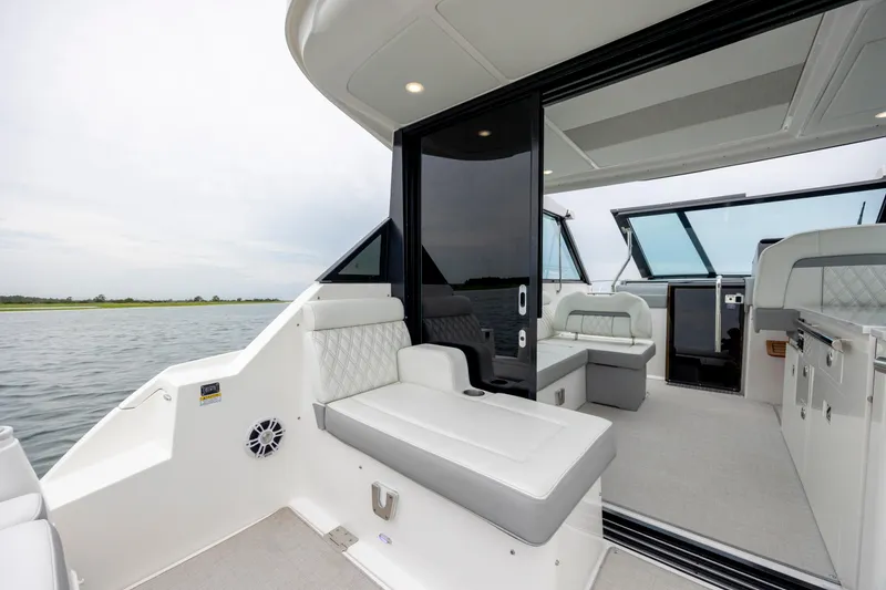 Slide: The Image of 2022 Regal 36 Grande Coupe interior with luxurious seating and modern design on the water. - 18