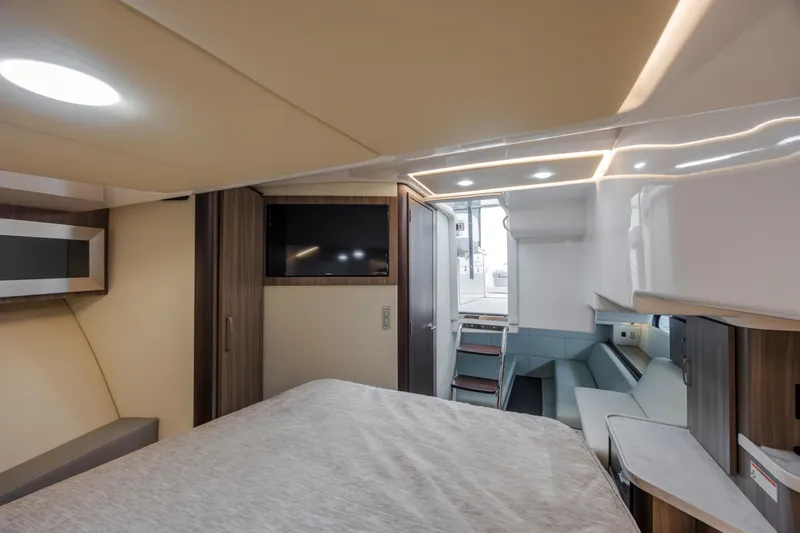 Slide: The Image of Interior of 2022 Regal 36 Grande Coupe yacht with modern design and cozy seating area. - 36