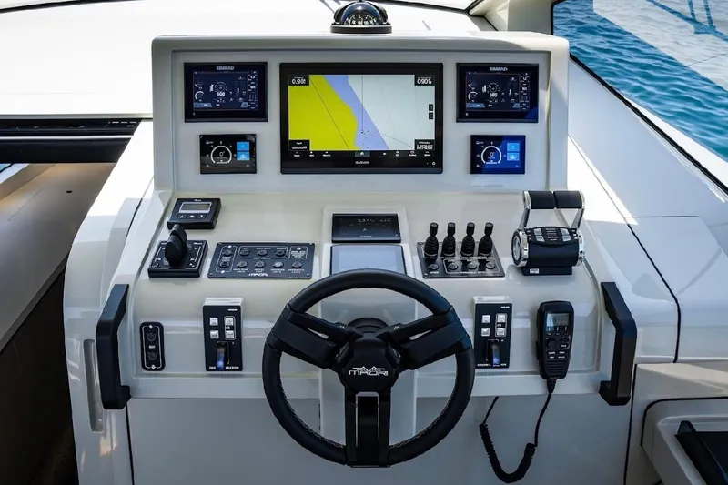 Slide: The Image of Helm of 2025 Maori 54ft XL yacht with advanced navigation controls and displays. - 11